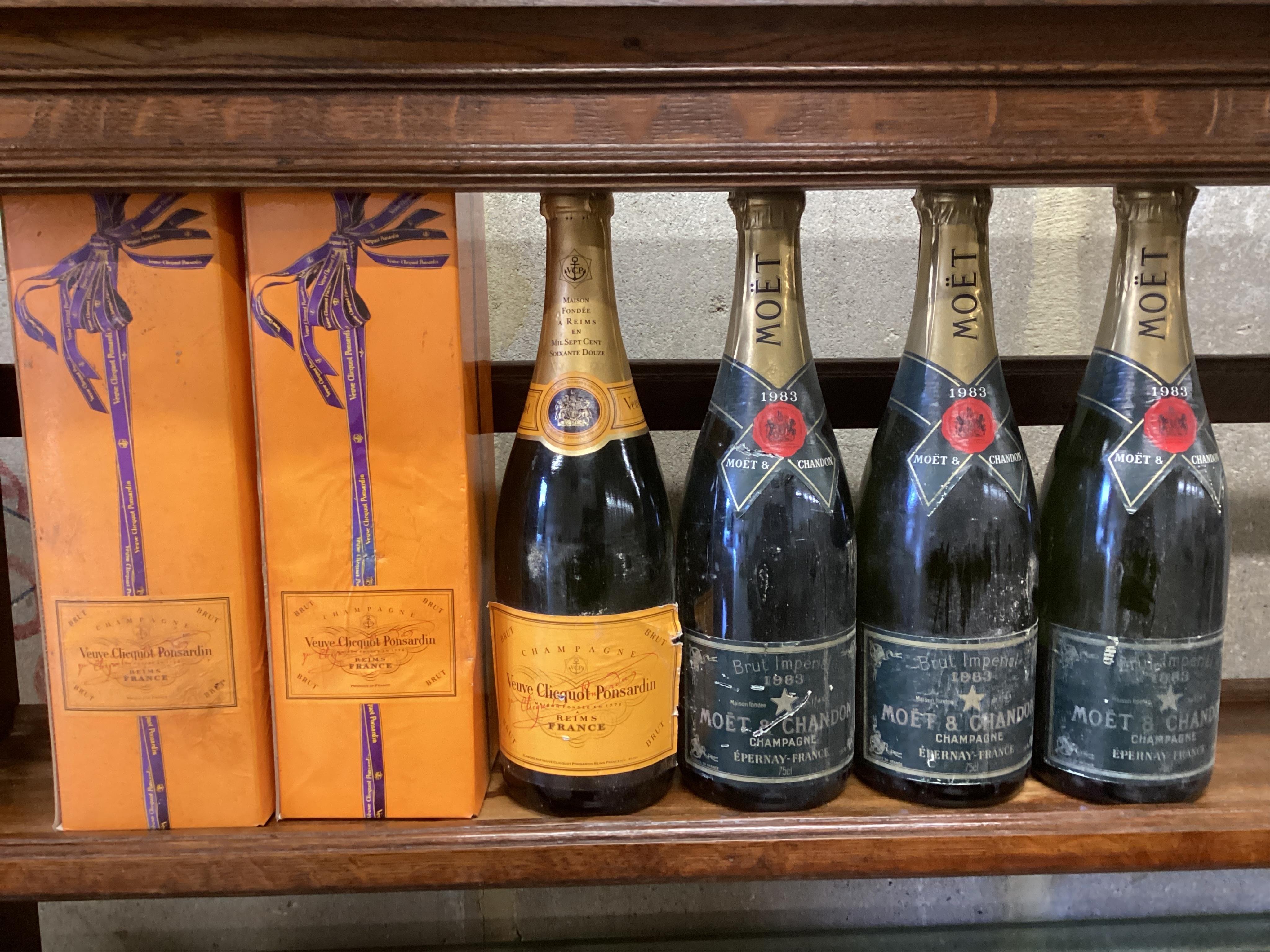 Three bottles of Moët & Chandon Brut Imperial vintage champagne 1983 and three bottles of Veuve Clicquot Ponsardin Brut champagne. (From a local private cellar). Condition - some labels degraded